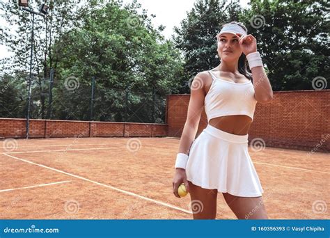 Portrait Of Young Woman Model Wearing Fashionable Tennis Dress Posing