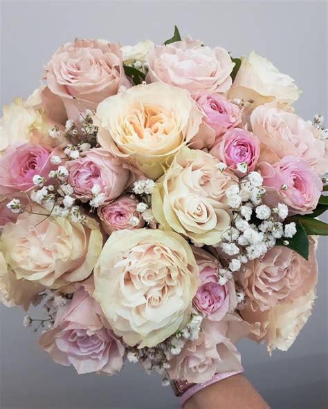 This Elegant Compact Style Bridal Bouquet Features Cream And Soft Pink