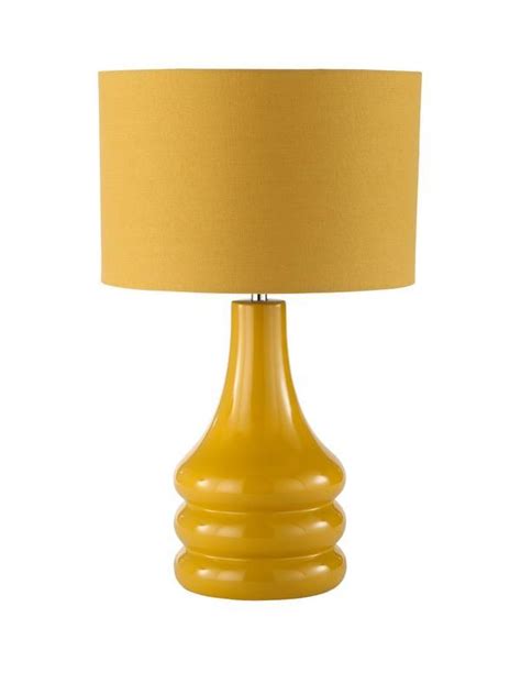 A Yellow Table Lamp On A White Background