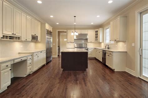 Love the dark wood floor in white kitchen house kitchen design. 31 "New" Custom White Kitchens with Wood Islands