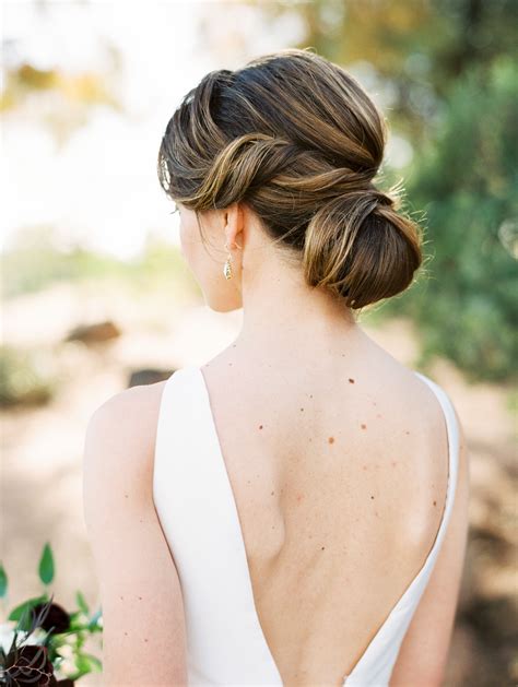 20 ways to style your hair in a low bun on your wedding day martha stewart weddings