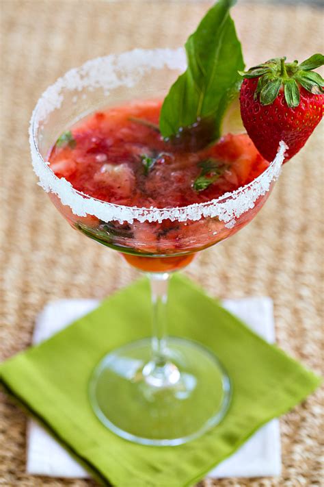 Remove the stems from your strawberries and place in a blender with fresh basil leaves and simple syrup. Strawberry Basil Margarita | The Drink Kings