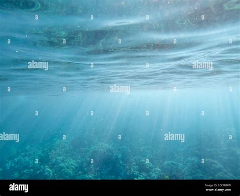 Underwater Rays Of Light With Ripples On Surface Stock Photo Alamy