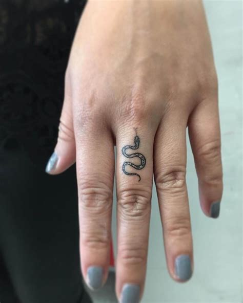 25 Amazing Small Snake Tattoo Ideas And Designs Finger Tattoo Designs