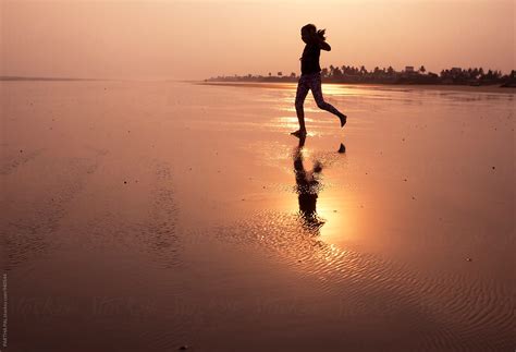 Girl Running On Beach