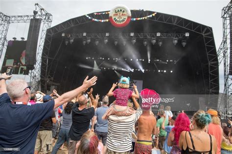 Festival Goers Listen To An Act On The Main Stage As They Enjoy The News Photo Getty Images