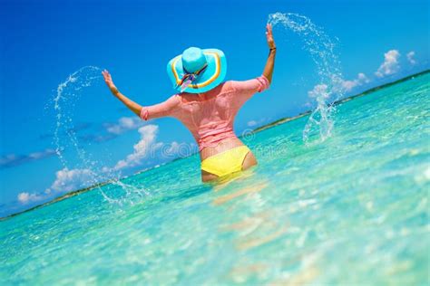 Woman In Bikini Having Fun On The Beach In Exuma Bahamas Stock Photo