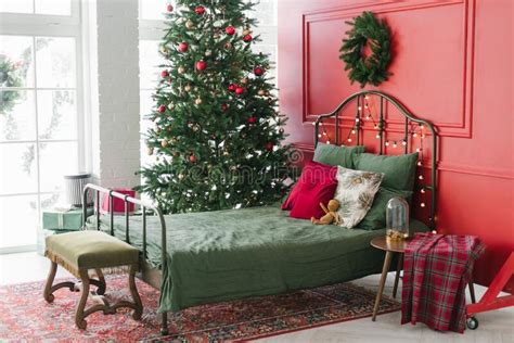 Cozy Decorated Bedroom For Christmas Holidays With A Christmas Tree By