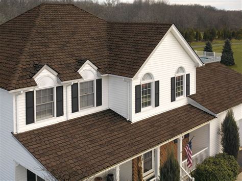 A soft/muted brown or the right color grey are your best choices. white house, black shutters, brown roof | For the Home | Pinterest | Brown roofs and Black shutters
