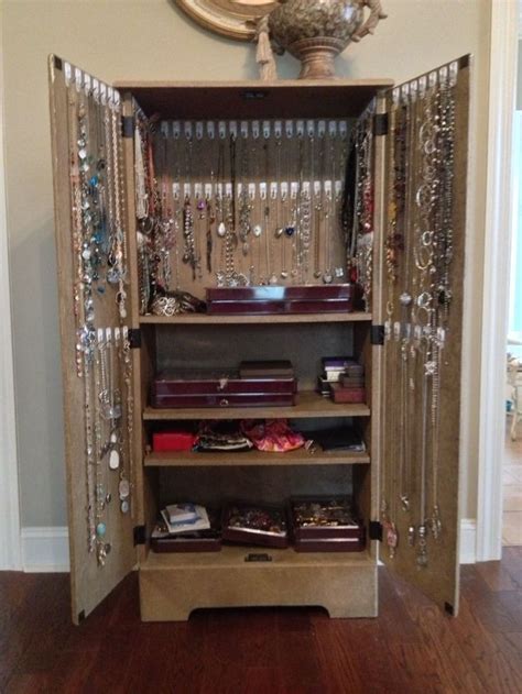 Cheap Media Cabinet And 90 Command Hooks Turned Jewelry Storage
