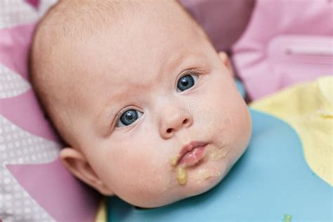 Baby Girl After Eating Porridge On Baby Chair Stock Image Image Of