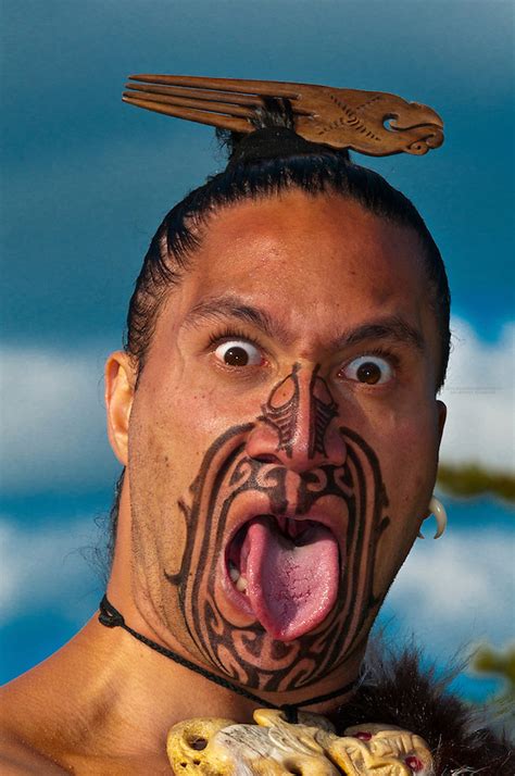 A Maori Warrior With A Ta Moko Facial Tattoo Performs A