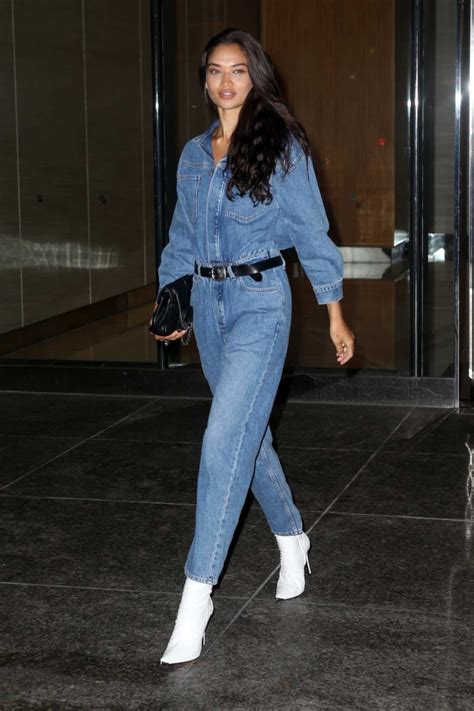 Shanina Shaik Rocks Denim Jumpsuit Paired With White High Heel Boots As