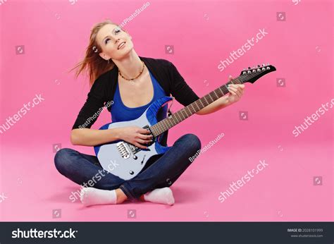 Beautiful Young Girl Playing Electric Guitar Stock Photo 2028101999