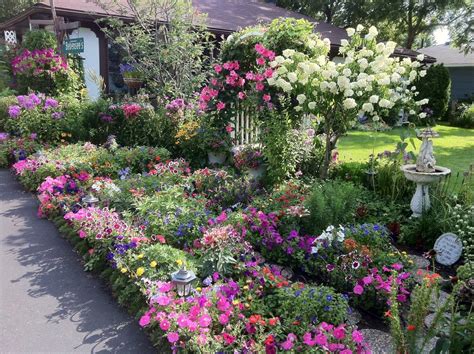 A front yard becomes a community garden. Our front yard | Flower garden, Different flowers, Front yard