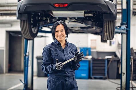 Auto Car Repair Service Center Happy Female Mechanic Standing By The