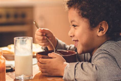 720 Black Child Eating Cereal Stock Photos Pictures And Royalty Free