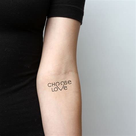 1) using scissors, cut out tattoo close to printed area. Little Tattoos — "Choose love" temporary tattoo on the left inner...
