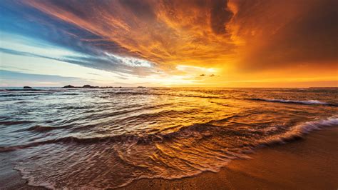 Wallpaper Waves Sand Beach Coast Rocks Clouds Sky Sunset