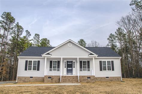 View 26 Modern White Vinyl Siding House