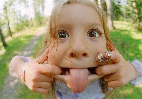 Cute Kids Little Girl Blonde Tongue Out Smile Smile Pictures