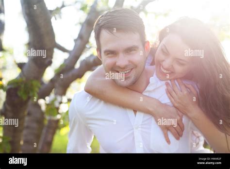 Young Couple In Love Kissing And Hugging In Nature Stock Photo Alamy