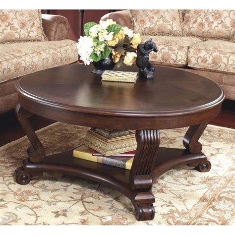 Dark brown coffee table set. Ashley Brookfield Round Coffee Table in Dark Brown - T496-8