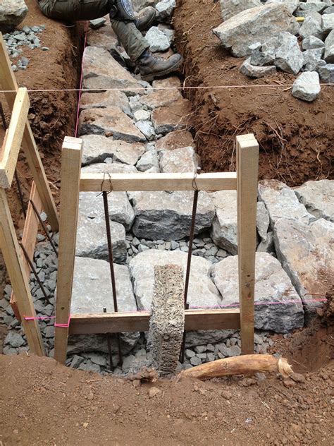Building a Stone Foundation | Dry stone wall, Stone cabin, Stone