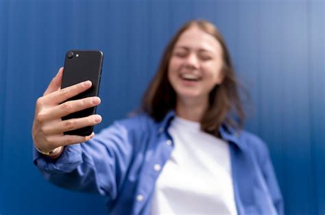 Premium Photo Caucasian Woman Taking A Selfie With Her Smartphone