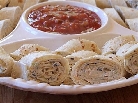 Lay out the tortillas and divide the mixture evenly in the center of each one. Texas Tortilla Roll-Ups