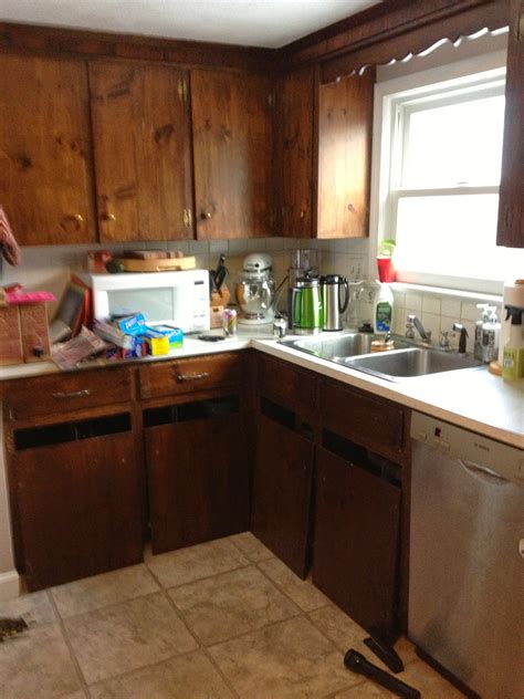 Knotty pine paneling stained fruitwood start in a corner at the top of a wall so that any drips run down the wall. A Colonial Cottage: The great kitchen cabinet renovation of 2014
