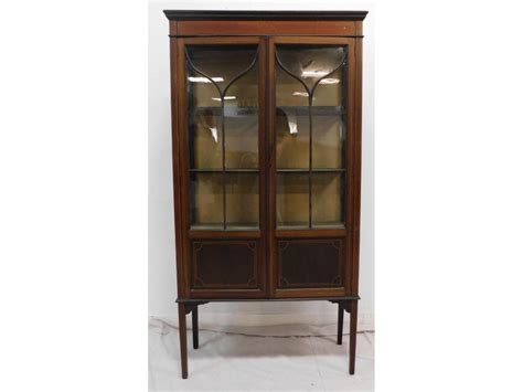 Cabinet is wrapped in double. Lot - Mahogany Inlaid Display Curio Cabinet on Legs