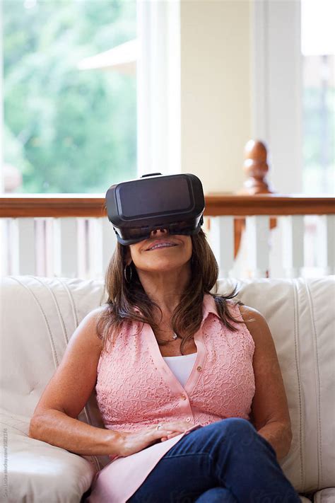 Vr Mature Woman Sits Back To Enjoy Virtual Reality Headset By