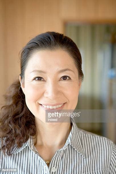 asian mature woman front view photos and premium high res pictures getty images