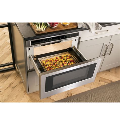 Warming drawers typically share the design of a microwave drawer, sliding out for easy access to the heating area. ZWL1126SJSS - Monogram 1.2 Cu. Ft. Drawer Microwave - The ...