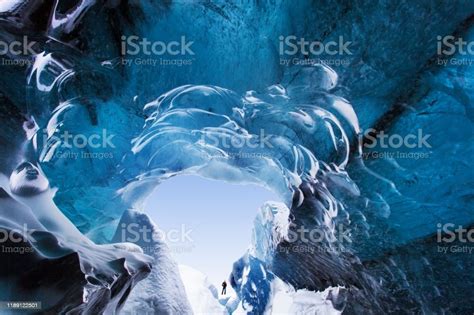 Blue Crystal Ice Cave And An Underground River Beneath The Glacier