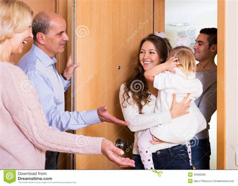 Family With Two Daughters Visiting Grand Parents Stock Photo - Image of ...