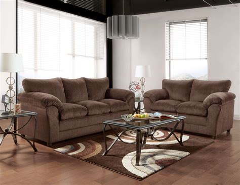 Featuring wide surface seating and plump pillow top arms, this set is perfect for family and friends to get together. Kelly Chocolate Sofa and Loveseat | Fabric Living Room Sets