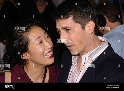 Actor Sandra Oh And Her Husband Director Alexander Payne Pose For