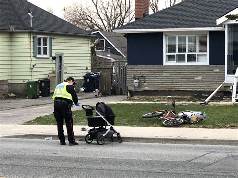 Woman walking with child in stroller struck by vehicle in Scarborough