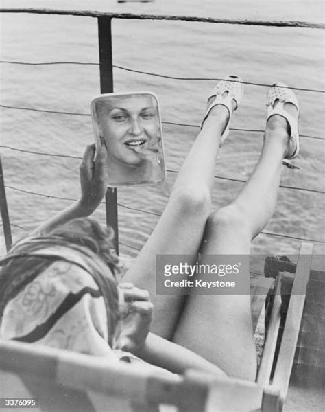 woman sunbathing on yacht photos and premium high res pictures getty images