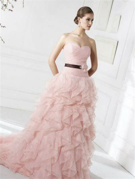 As timeless as they come, this pink strapless gown is a classic bride's dream. Pink Wedding Dresses