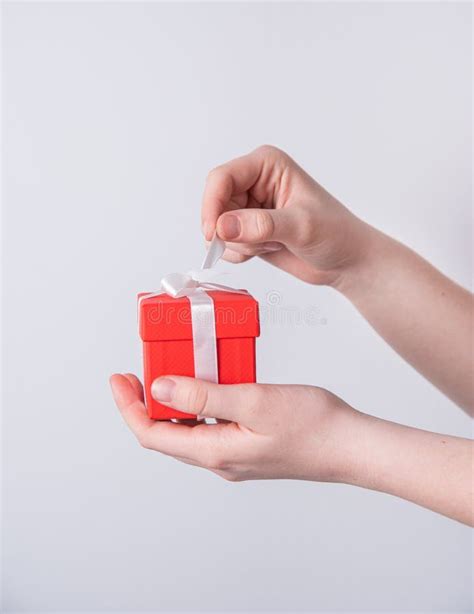 Women S Hands Open Red Holiday T Box With White Ribbon Stock Image