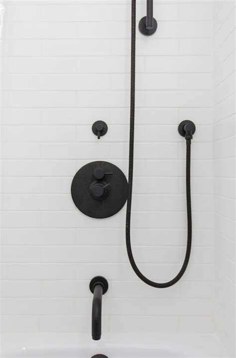 Modern black wall mounted faucet. A Modern Gut Renovation Goes Scandinavian Chic