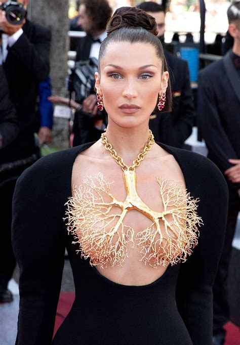Bella Hadid Covers Boobs With Gilded Brass Lung Necklace In Cannes