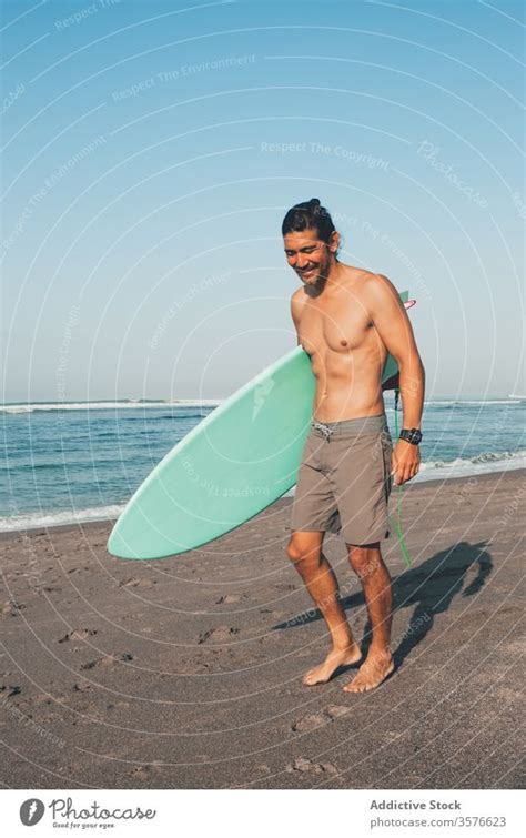 Man At The Beach With Surfboard By Brandon Tabiolo Printscapes