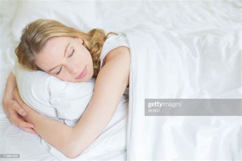 Pretty Blonde Woman Sleeping In Bed Photo Getty Images