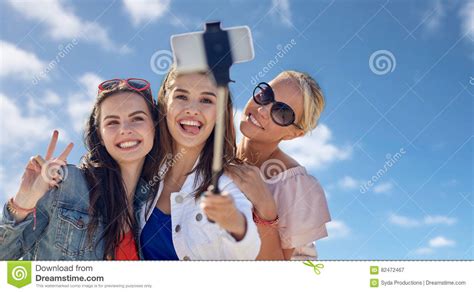 Group Of Smiling Women Taking Selfie Over Blue Sky Stock Image Image Of Portrait Friends