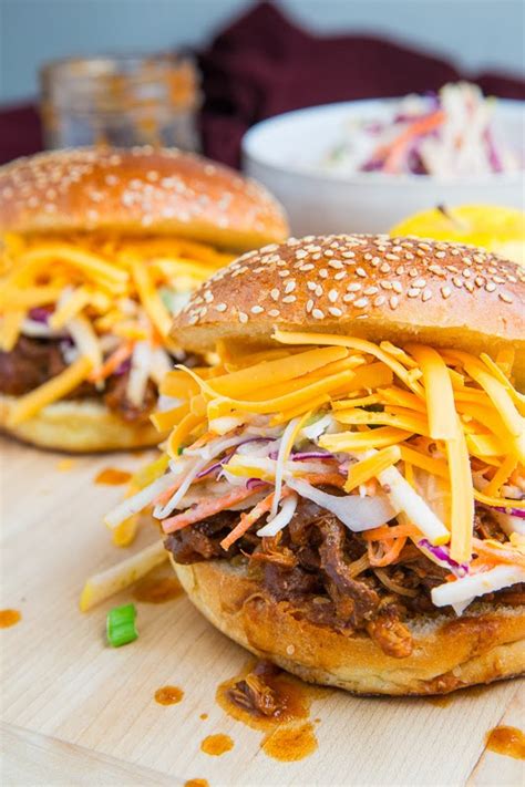 Tender and flavorful, put the chicken and ingredients in the slow cooker in the morning, make the sauce ahead of time and dinner is easy when you get home in the evening! Apple BBQ Pulled Chicken Sandwiches with Apple Slaw on Closet Cooking