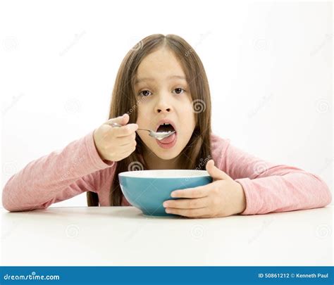Young Girl Eating Cereal Stock Photo Image Of Young 50861212